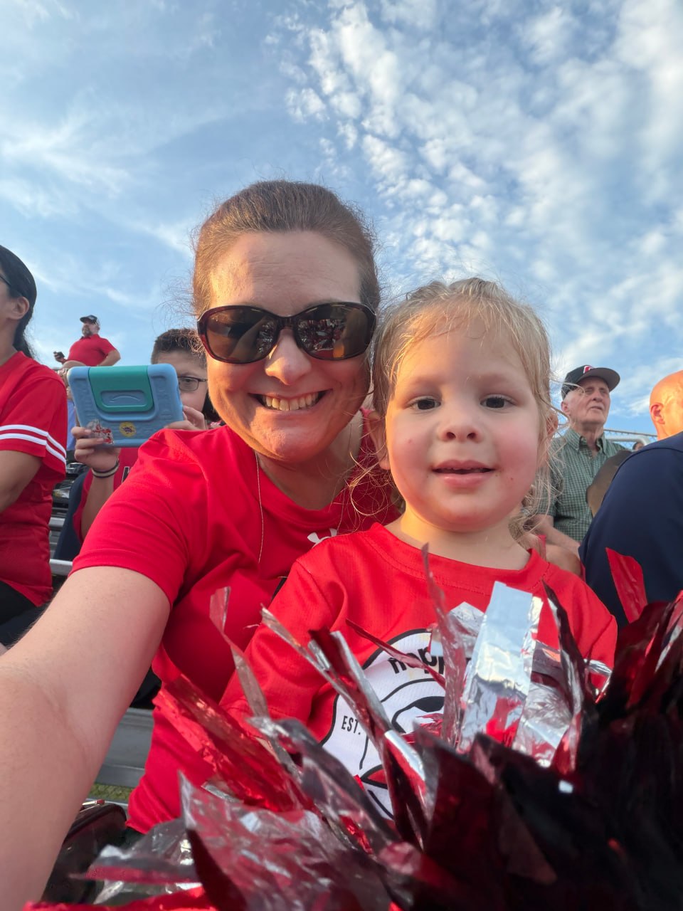 Kelly Melody with her young daughter at a sporting event